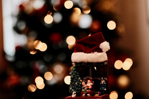 a christmas tree with a santa hat on top of it