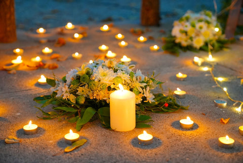 a bunch of candles that are on the ground