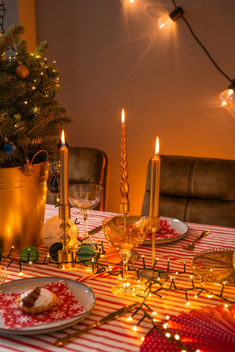 a table with plates and glasses with food on it
