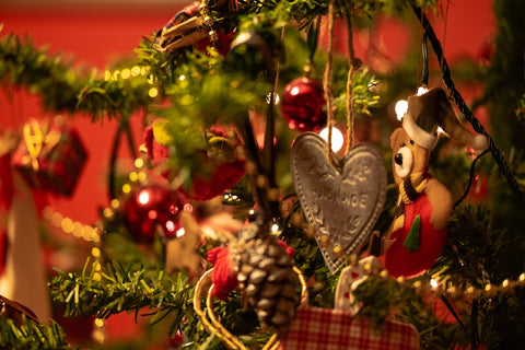 a close up of a christmas tree with ornaments
