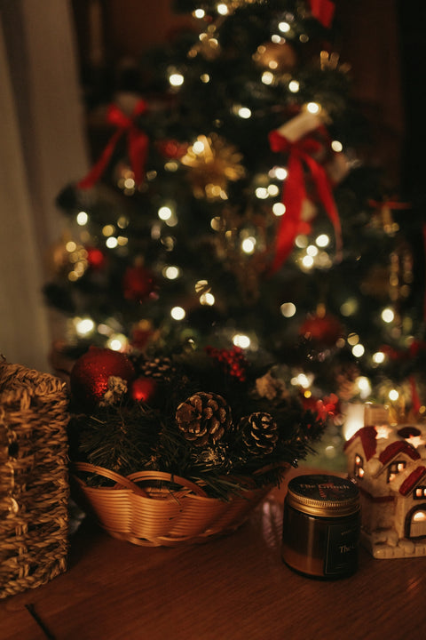 A small christmas tree with presents under it